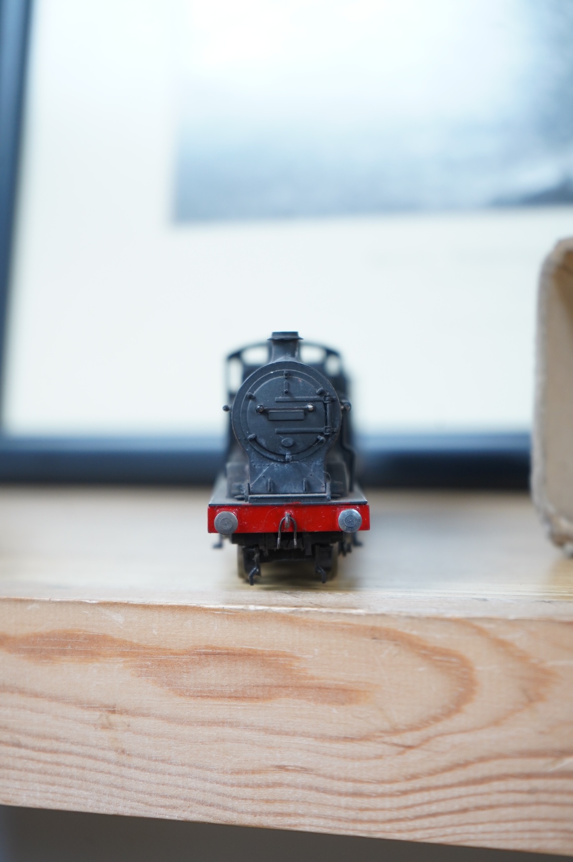 Two kit built and adapted EM gauge LMS railway locomotives; an 0-8-0, 9518, and an 0-6-0 class 4F based on an Airfix kit, together with the body only of an SR Schools Class
